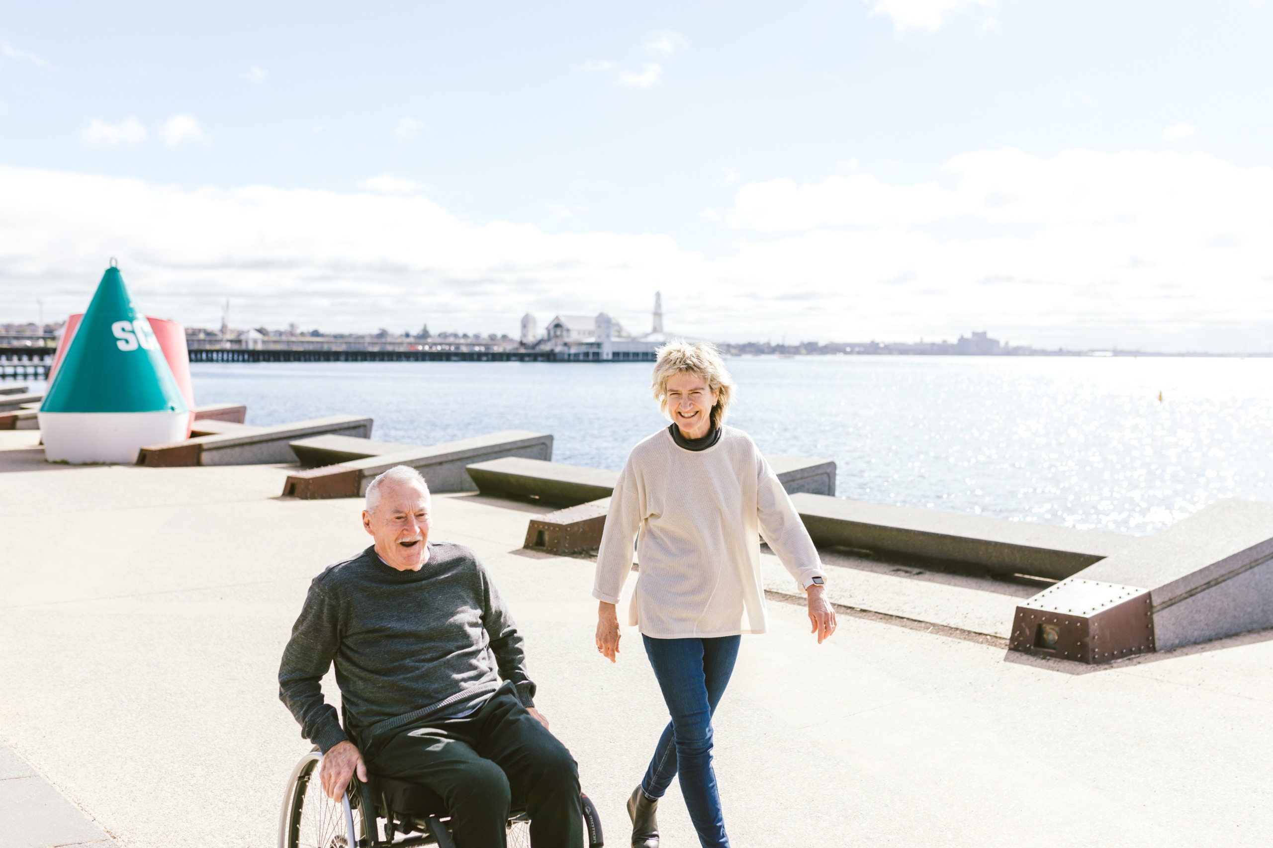 Older people walking and cycling along a path